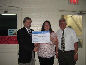 Tom Rachfalski (l), chapter president, presents the chapter's 2008 Science Teaching Tools Grant check to Tracey Edwards (c), science teacher, and George Henry, principal, Highland Park School, in June.